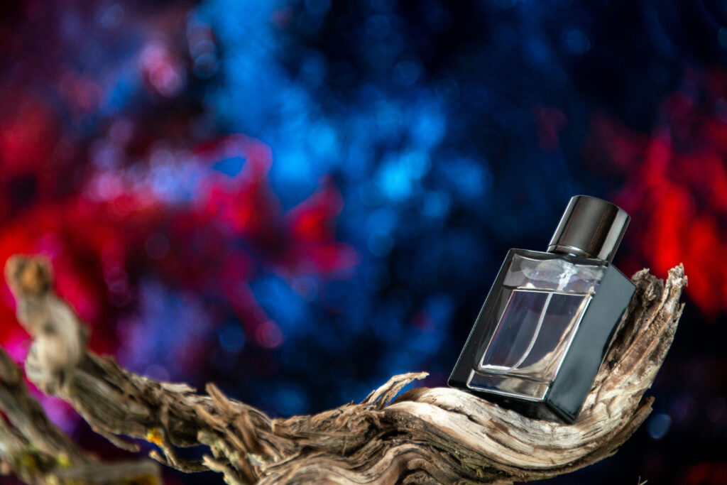 front view men perfume dried tree branch isolated blue red abstract background free space